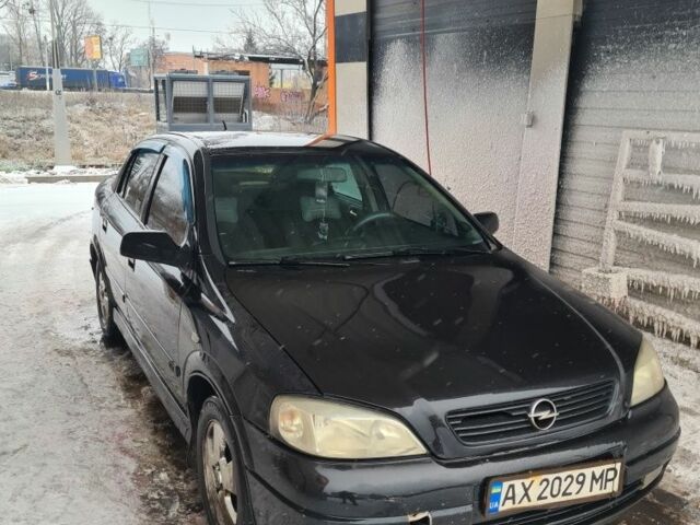 Черный Опель Астра, объемом двигателя 1.6 л и пробегом 254 тыс. км за 2400 $, фото 1 на Automoto.ua