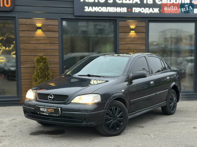 Черный Опель Астра, объемом двигателя 1.4 л и пробегом 102 тыс. км за 3600 $, фото 1 на Automoto.ua