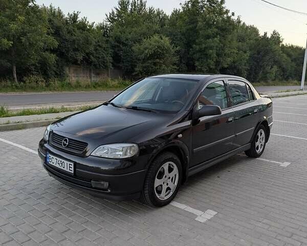 Черный Опель Астра, объемом двигателя 1.6 л и пробегом 215 тыс. км за 3900 $, фото 1 на Automoto.ua