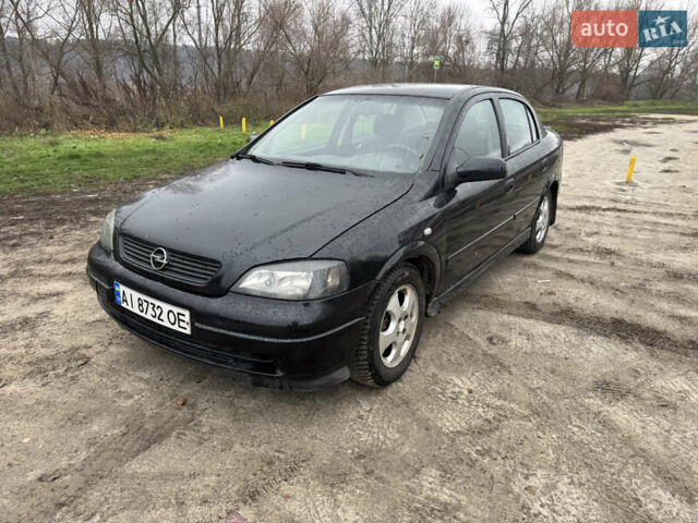 Черный Опель Астра, объемом двигателя 1.7 л и пробегом 300 тыс. км за 2999 $, фото 1 на Automoto.ua