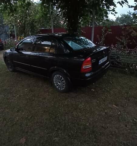 Черный Опель Астра, объемом двигателя 1.4 л и пробегом 129 тыс. км за 3500 $, фото 1 на Automoto.ua