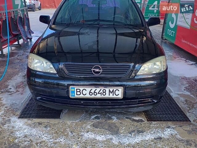Черный Опель Астра, объемом двигателя 1.4 л и пробегом 201 тыс. км за 3650 $, фото 1 на Automoto.ua