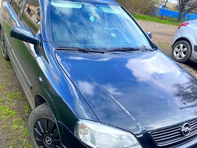Черный Опель Астра, объемом двигателя 1.4 л и пробегом 215 тыс. км за 3500 $, фото 1 на Automoto.ua