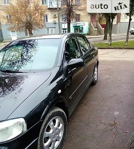 Черный Опель Астра, объемом двигателя 1.4 л и пробегом 155 тыс. км за 3500 $, фото 1 на Automoto.ua