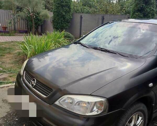 Черный Опель Астра, объемом двигателя 1.4 л и пробегом 200 тыс. км за 3500 $, фото 1 на Automoto.ua
