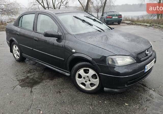 Черный Опель Астра, объемом двигателя 1.7 л и пробегом 260 тыс. км за 2900 $, фото 1 на Automoto.ua