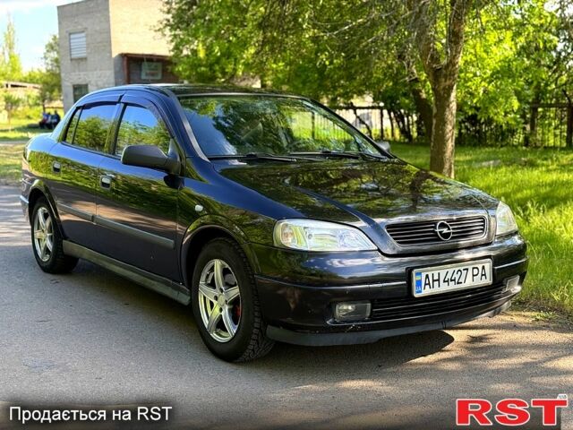 Черный Опель Астра, объемом двигателя 1.4 л и пробегом 140 тыс. км за 4000 $, фото 1 на Automoto.ua