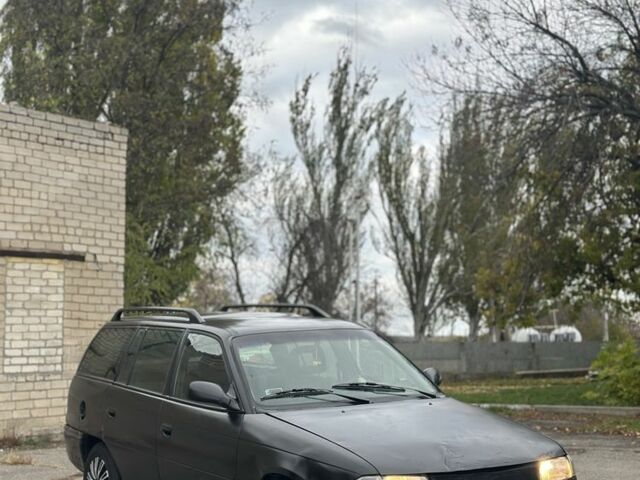 Черный Опель Астра, объемом двигателя 1.6 л и пробегом 341 тыс. км за 1000 $, фото 1 на Automoto.ua