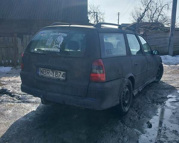 Черный Опель Астра, объемом двигателя 2 л и пробегом 180 тыс. км за 750 $, фото 1 на Automoto.ua