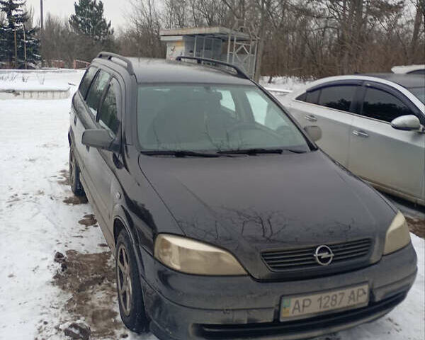 Черный Опель Астра, объемом двигателя 1.8 л и пробегом 255 тыс. км за 2600 $, фото 1 на Automoto.ua
