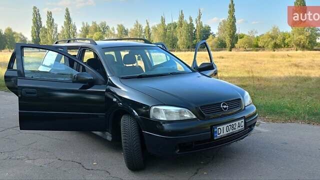 Черный Опель Астра, объемом двигателя 2 л и пробегом 315 тыс. км за 3249 $, фото 1 на Automoto.ua