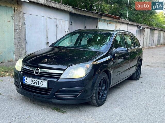 Черный Опель Астра, объемом двигателя 1.6 л и пробегом 180 тыс. км за 3799 $, фото 1 на Automoto.ua