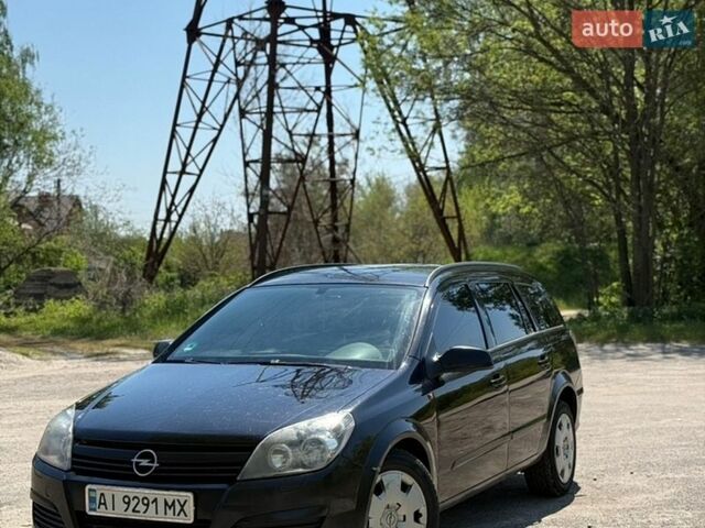 Черный Опель Астра, объемом двигателя 1.9 л и пробегом 325 тыс. км за 4700 $, фото 1 на Automoto.ua