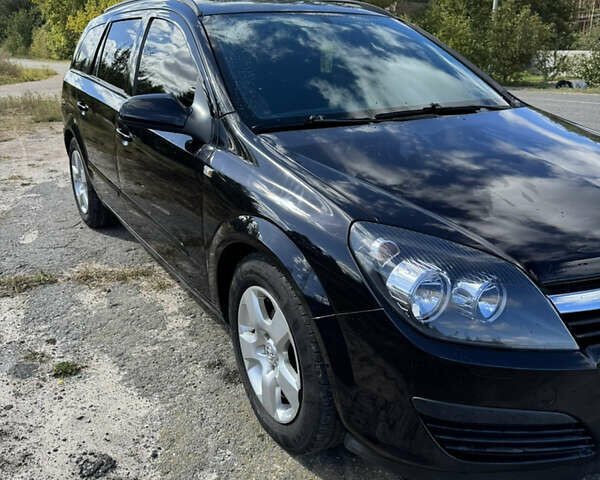 Черный Опель Астра, объемом двигателя 1.6 л и пробегом 248 тыс. км за 5200 $, фото 1 на Automoto.ua