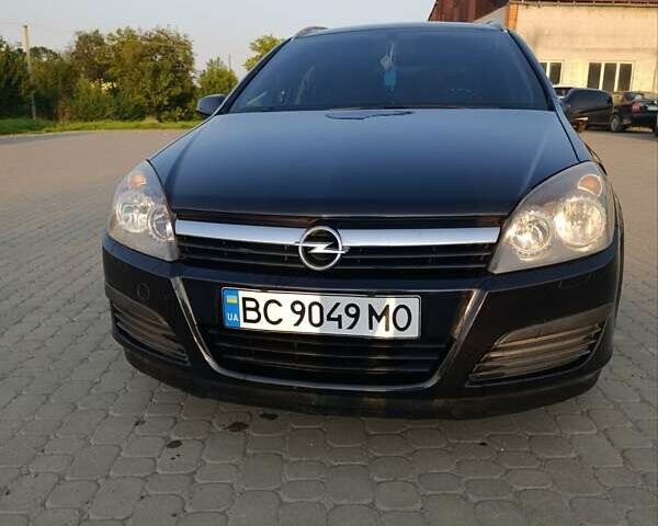 Черный Опель Астра, объемом двигателя 1.6 л и пробегом 230 тыс. км за 4300 $, фото 1 на Automoto.ua