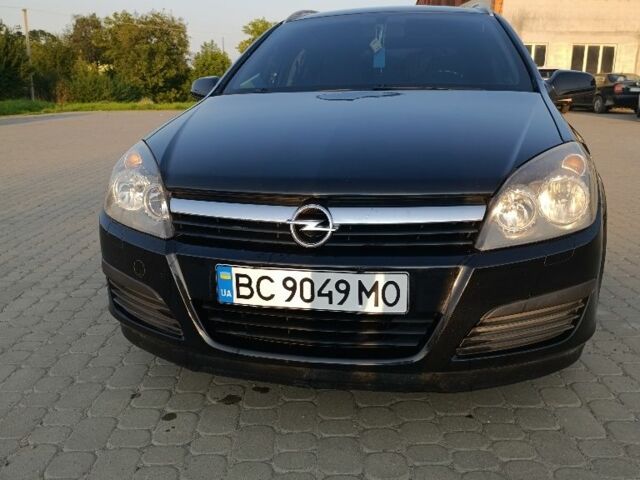Черный Опель Астра, объемом двигателя 1.6 л и пробегом 230 тыс. км за 3900 $, фото 1 на Automoto.ua