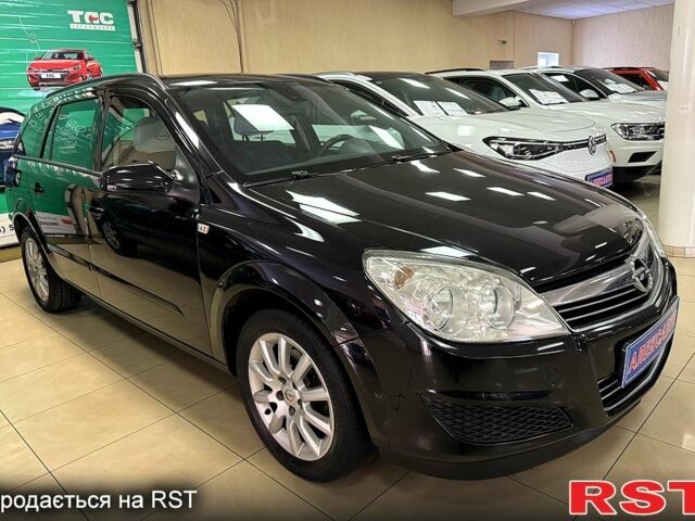 Черный Опель Астра, объемом двигателя 1.4 л и пробегом 210 тыс. км за 5600 $, фото 1 на Automoto.ua