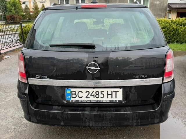 Черный Опель Астра, объемом двигателя 1.69 л и пробегом 240 тыс. км за 5100 $, фото 1 на Automoto.ua