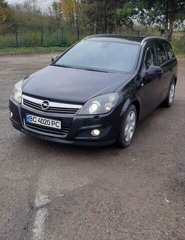 Черный Опель Астра, объемом двигателя 1.69 л и пробегом 252 тыс. км за 5600 $, фото 1 на Automoto.ua
