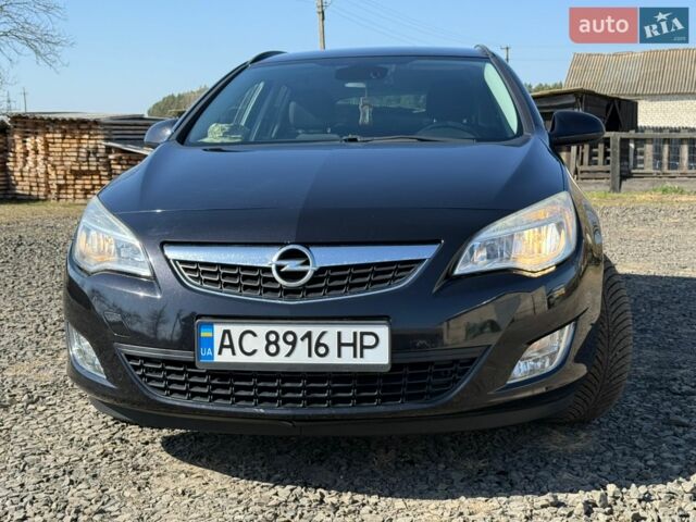 Черный Опель Астра, объемом двигателя 1.25 л и пробегом 243 тыс. км за 7290 $, фото 1 на Automoto.ua