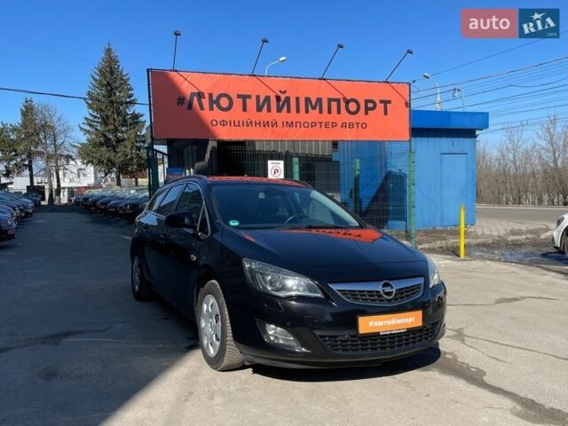 Черный Опель Астра, объемом двигателя 1.4 л и пробегом 210 тыс. км за 8600 $, фото 1 на Automoto.ua