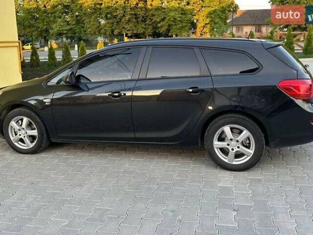 Черный Опель Астра, объемом двигателя 1.7 л и пробегом 250 тыс. км за 7900 $, фото 1 на Automoto.ua