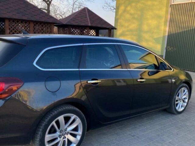 Черный Опель Астра, объемом двигателя 1.4 л и пробегом 191 тыс. км за 9500 $, фото 1 на Automoto.ua