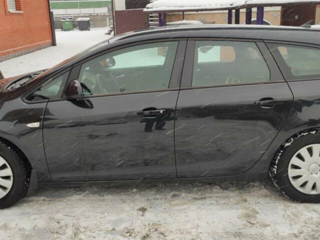 Черный Опель Астра, объемом двигателя 1.2 л и пробегом 375 тыс. км за 4400 $, фото 1 на Automoto.ua