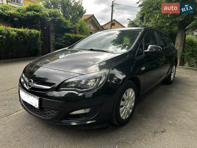 Черный Опель Астра, объемом двигателя 1.4 л и пробегом 180 тыс. км за 5900 $, фото 1 на Automoto.ua