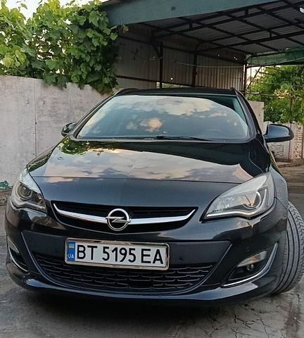 Черный Опель Астра, объемом двигателя 1.7 л и пробегом 254 тыс. км за 8700 $, фото 1 на Automoto.ua