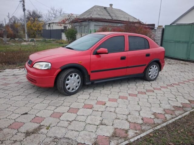 Красный Опель Астра, объемом двигателя 1.4 л и пробегом 200 тыс. км за 1650 $, фото 1 на Automoto.ua