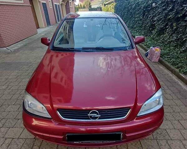 Красный Опель Астра, объемом двигателя 1.5 л и пробегом 312 тыс. км за 2520 $, фото 1 на Automoto.ua
