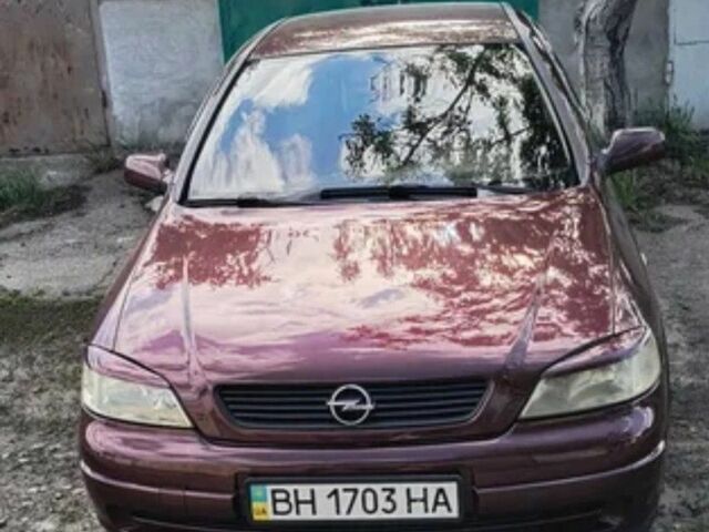Красный Опель Астра, объемом двигателя 1.4 л и пробегом 210 тыс. км за 3600 $, фото 1 на Automoto.ua