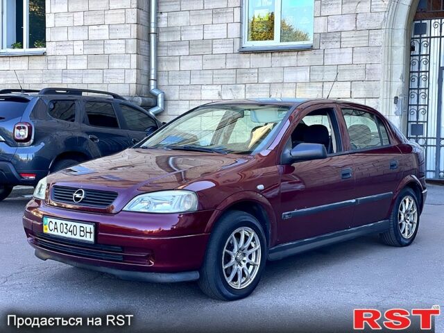 Красный Опель Астра, объемом двигателя 1.6 л и пробегом 250 тыс. км за 3300 $, фото 1 на Automoto.ua