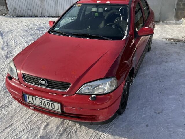 Красный Опель Астра, объемом двигателя 1.7 л и пробегом 244 тыс. км за 2000 $, фото 1 на Automoto.ua