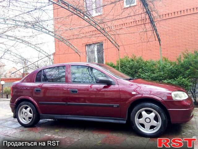 Красный Опель Астра, объемом двигателя 1.6 л и пробегом 200 тыс. км за 4500 $, фото 1 на Automoto.ua