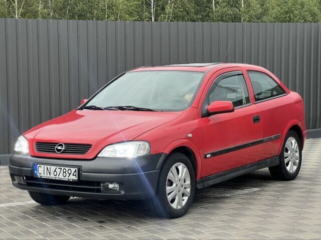 Красный Опель Астра, объемом двигателя 1.6 л и пробегом 324 тыс. км за 1500 $, фото 1 на Automoto.ua