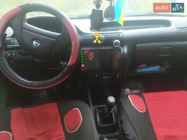 Красный Опель Астра, объемом двигателя 1.6 л и пробегом 254 тыс. км за 1800 $, фото 1 на Automoto.ua