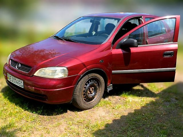 Червоний Опель Астра, об'ємом двигуна 1.4 л та пробігом 277 тис. км за 2050 $, фото 1 на Automoto.ua