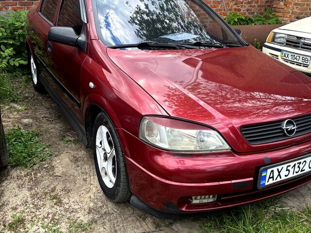 Червоний Опель Астра, об'ємом двигуна 1.4 л та пробігом 200 тис. км за 2600 $, фото 1 на Automoto.ua