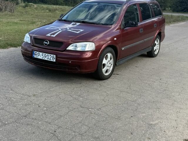 Красный Опель Астра, объемом двигателя 2 л и пробегом 300 тыс. км за 1250 $, фото 1 на Automoto.ua