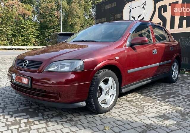 Красный Опель Астра, объемом двигателя 1.6 л и пробегом 218 тыс. км за 3900 $, фото 1 на Automoto.ua