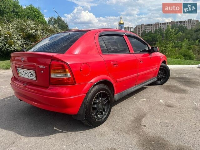 Красный Опель Астра, объемом двигателя 1.8 л и пробегом 319 тыс. км за 2350 $, фото 1 на Automoto.ua