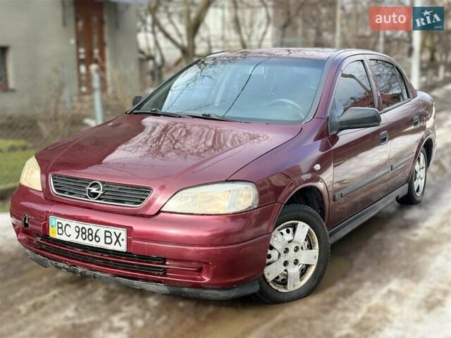 Красный Опель Астра, объемом двигателя 1.4 л и пробегом 250 тыс. км за 2400 $, фото 1 на Automoto.ua