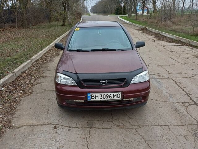 Красный Опель Астра, объемом двигателя 1.4 л и пробегом 170 тыс. км за 3300 $, фото 1 на Automoto.ua