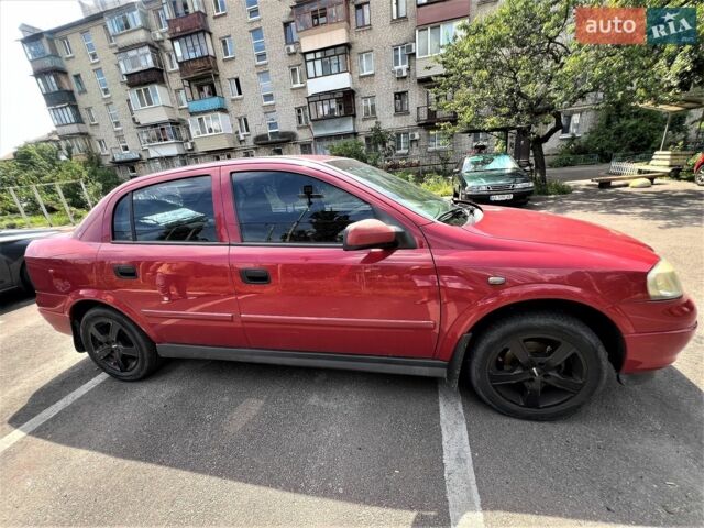 Красный Опель Астра, объемом двигателя 1.36 л и пробегом 182 тыс. км за 5200 $, фото 1 на Automoto.ua