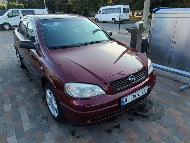 Красный Опель Астра, объемом двигателя 1.4 л и пробегом 226 тыс. км за 4500 $, фото 1 на Automoto.ua