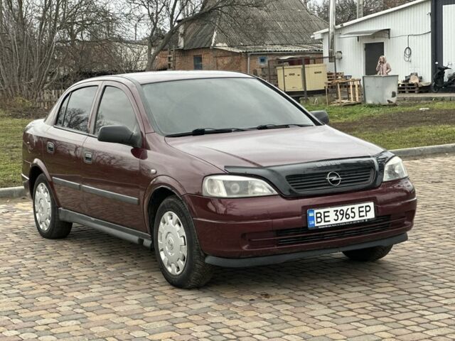 Красный Опель Астра, объемом двигателя 1.4 л и пробегом 245 тыс. км за 3400 $, фото 1 на Automoto.ua