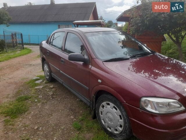 Красный Опель Астра, объемом двигателя 1.4 л и пробегом 217 тыс. км за 4000 $, фото 1 на Automoto.ua