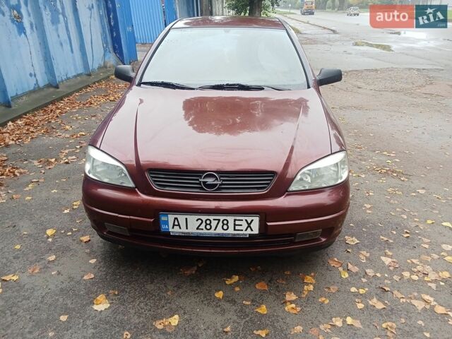 Красный Опель Астра, объемом двигателя 1.4 л и пробегом 280 тыс. км за 2300 $, фото 1 на Automoto.ua